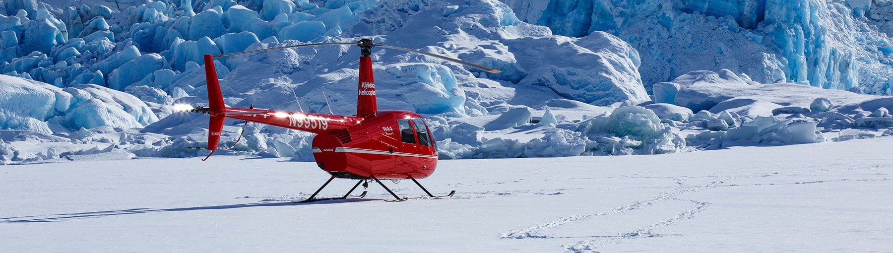 Helicopter landed on glacier.